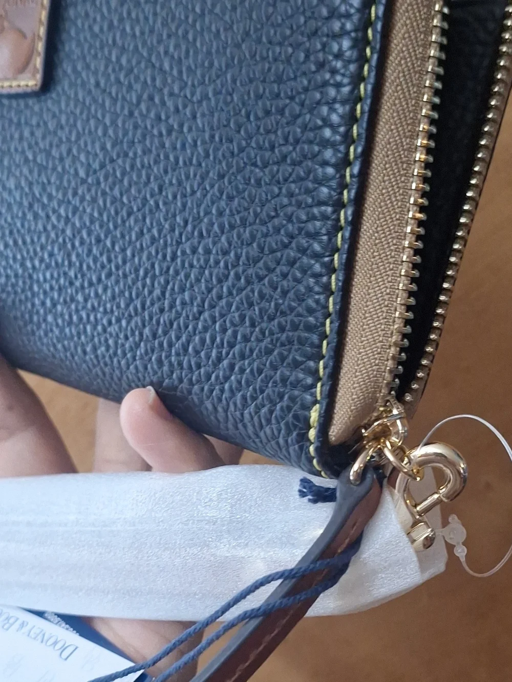 Dooney & Bourke Black Pebbled Zip Wallet with Tan Trim